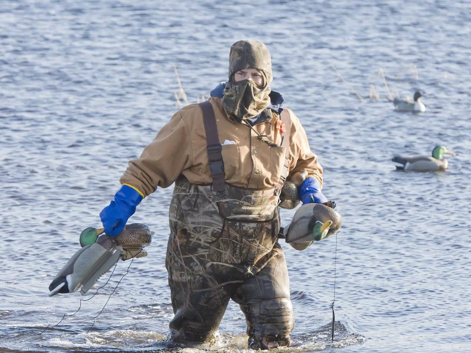 Cold weather duck hunting with insulated waders and full face covering