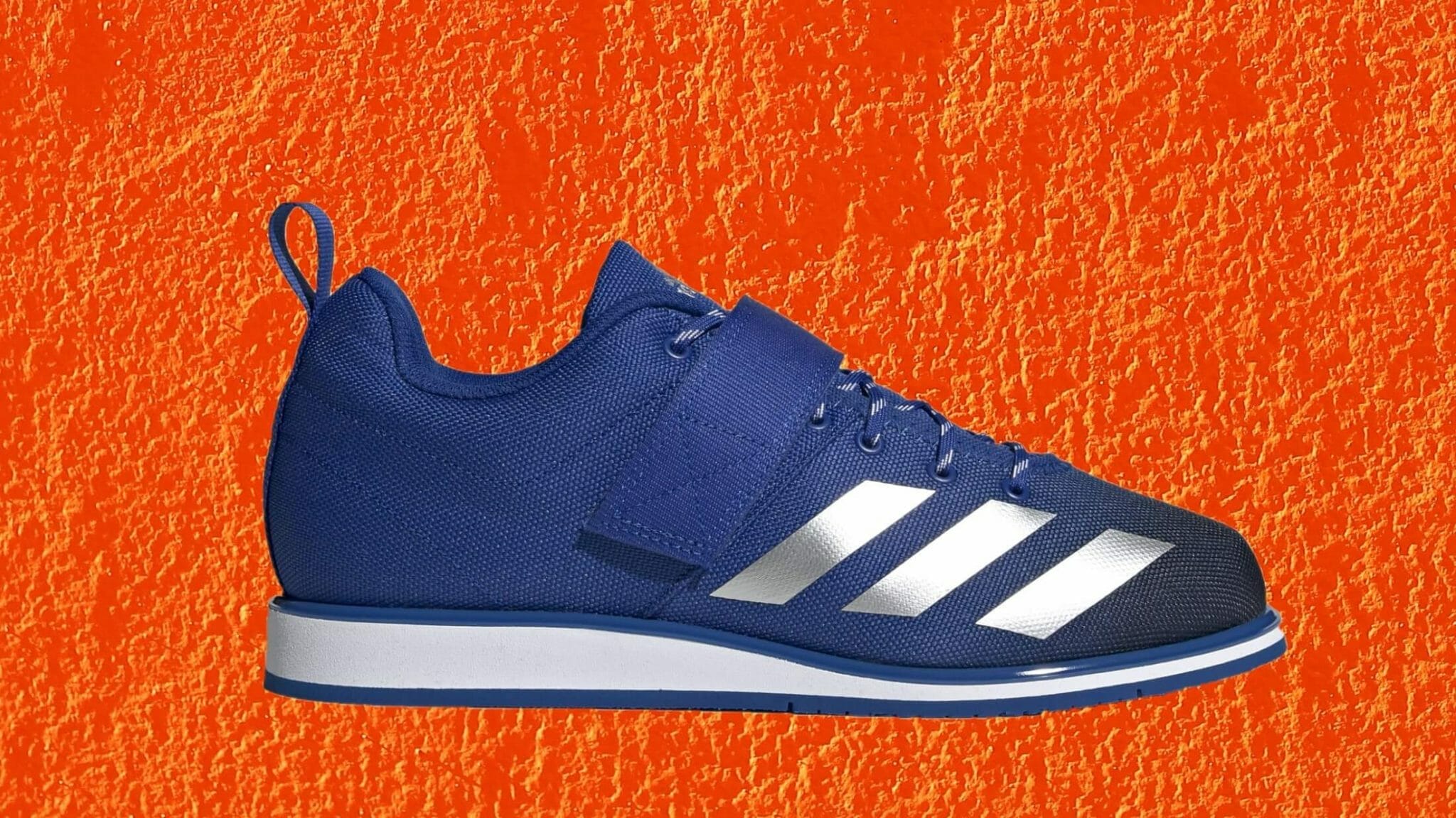 adidas Powerlift blue and silver metallic on orange background. Formerly known as the Powerlift 4.